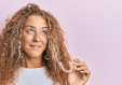 Bildnachweis für: Beautiful caucasian teenager girl holding invisible aligner orth